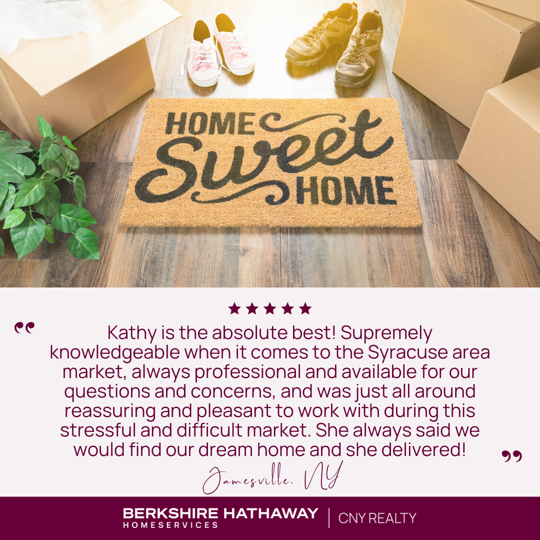 A welcome mat that says "home sweet home" with some moving boxes and shoes around it